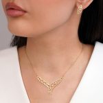 نیم ست جواهری نگین سفید تیتانیوم طلایی